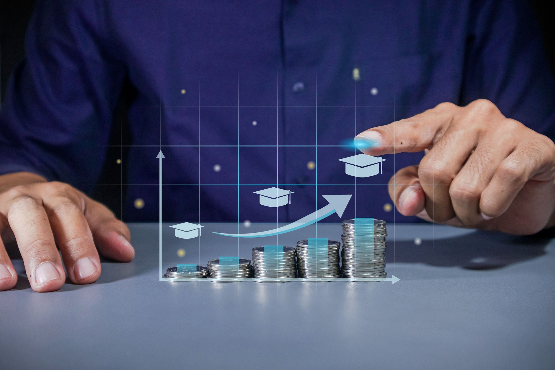 Man pointing to virtual screen of increasing education cost. Stack of coins for education or tuition fees.